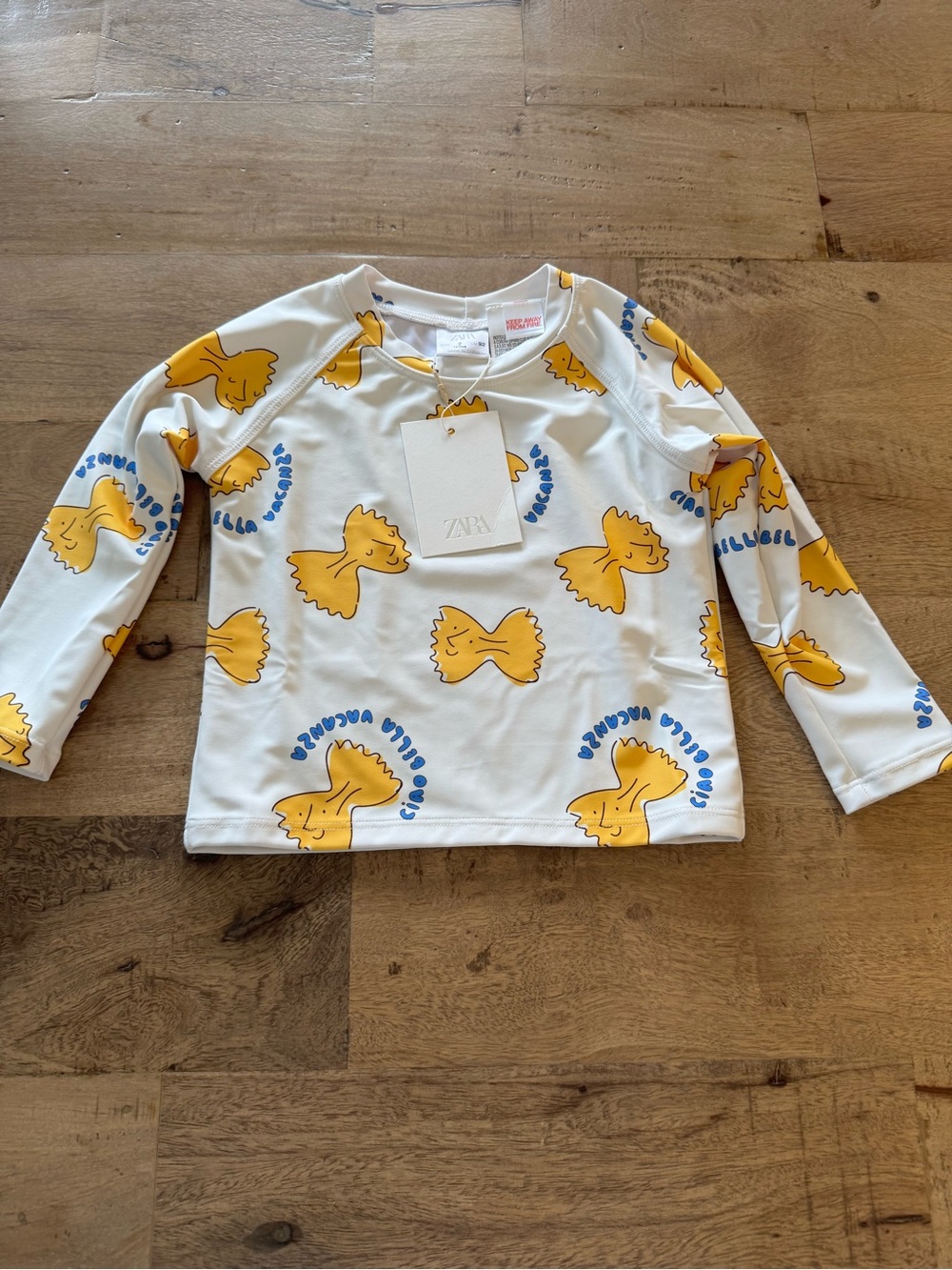 Zara new Kids White Long Sleeve swim pool Top with pasta Bow Print size 2